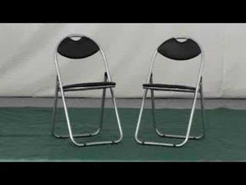 Padded folding chair with silver steel  frame black seat and back